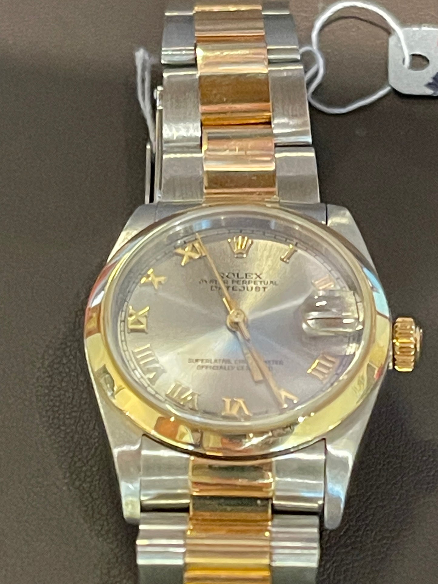 Rolex Oyster Perpetual Datejust in a two-tone or Rolesor configuration, combining stainless steel and yellow gold.