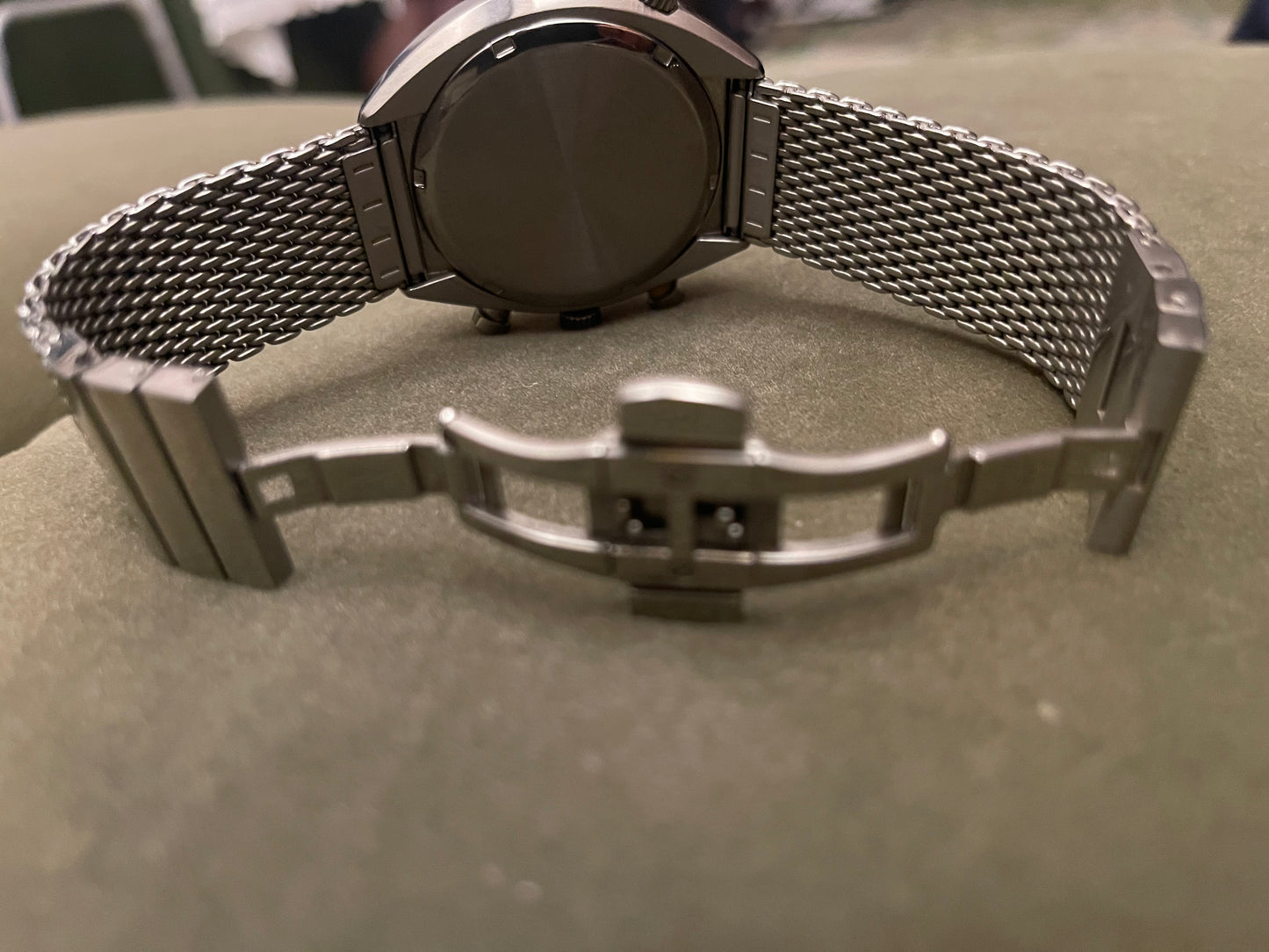 This is a Bulova Accutron II Lobster Chronograph watch with a black dial and a stainless steel mesh bracelet